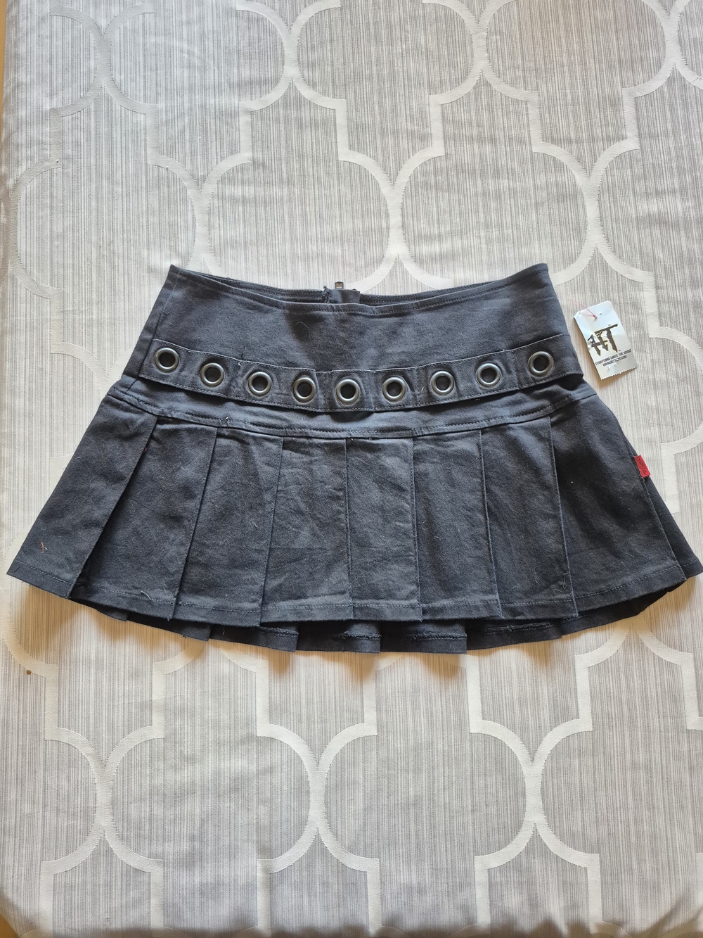Tripp nyc (Daang Goodman) Women's Black Pleated Mini Skirt with Grommet Detail